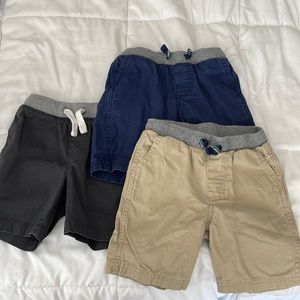 3 pairs of shorts grey, blue, and beige